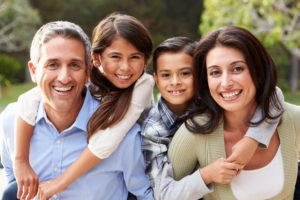 Image of a family of 4 who look for a practice like Southridge Dental who provide family dentistry services to all members and ages in one place in Surrey, BC Canada.