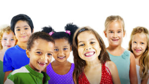Image of group of children that all need comprehensive pediatric dentistry services to learn good oral health skills for life.